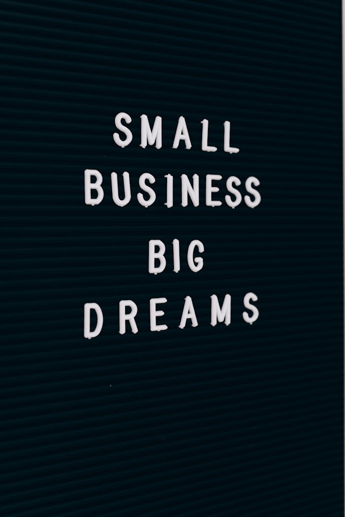 Crafting Captivating Headlines: Your awesome post title goes here Close-up of a motivational quote about small business dreams on a letter board.